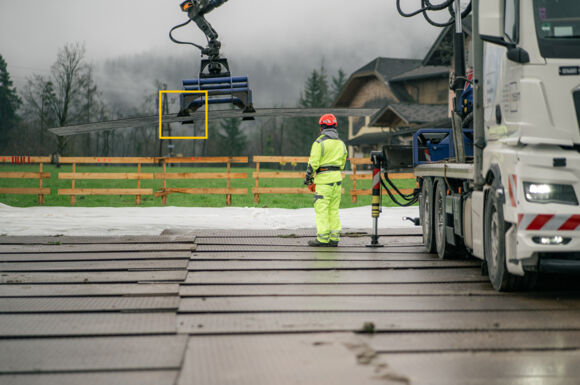 Cteam infrastructure construction using crane for material handling on temporary access mats. Cteam infrastructure construction using crane for material handling on temporary access mats.